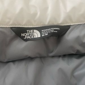 The North Face size medium white puffer vest. Only worn ONCE!
